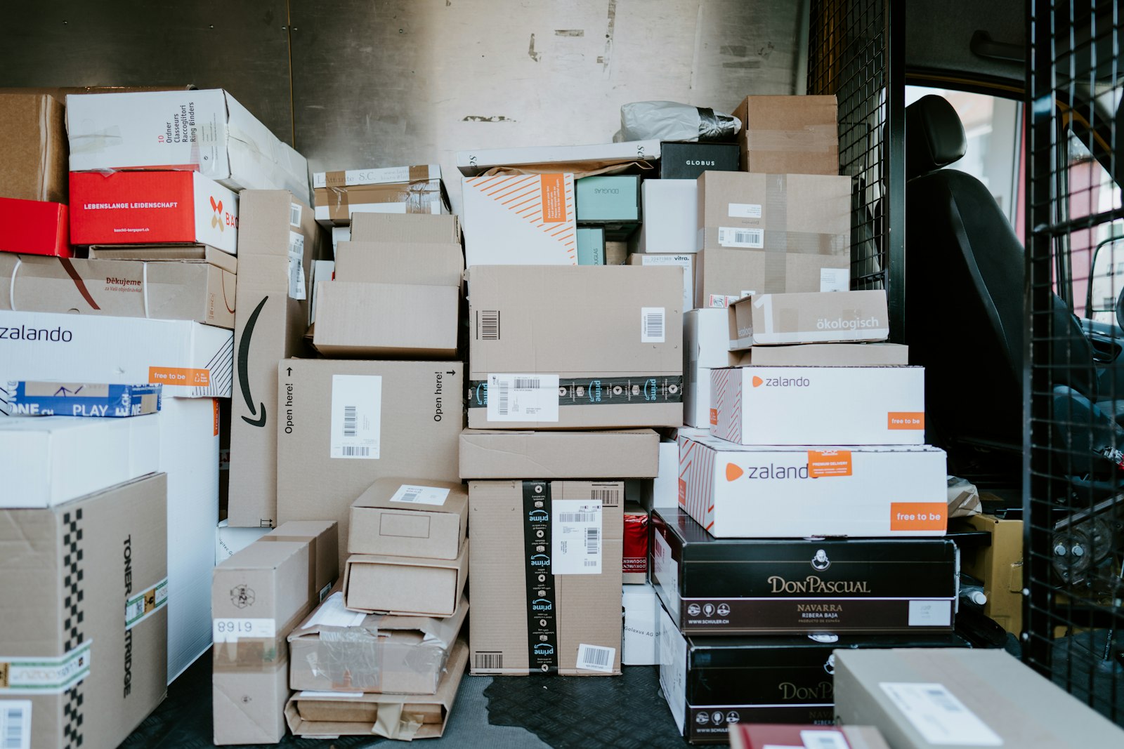 Cargo van loaded with merchandise parcels ready for dispatch